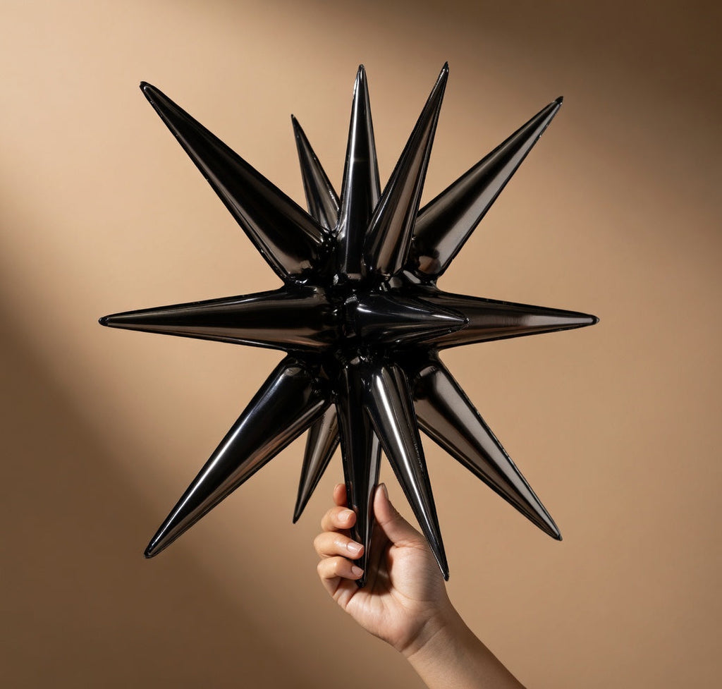 Six black star-shaped foil balloons. Various sizes available: 27-inch and 22-inch large black explosive spiked foil balloons, suitable for graduation ceremonies, birthdays, retirement anniversaries, and space-themed party decorations. Vatoyum Balloons