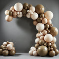 This 140-piece neutral-colored balloon arch set includes 5, 10, 12, and 18-inch balloons in brown, beige, nude, and light brown, suitable for birthday parties and neutral bear-themed baby shower decorations. Vatoyum Balloons